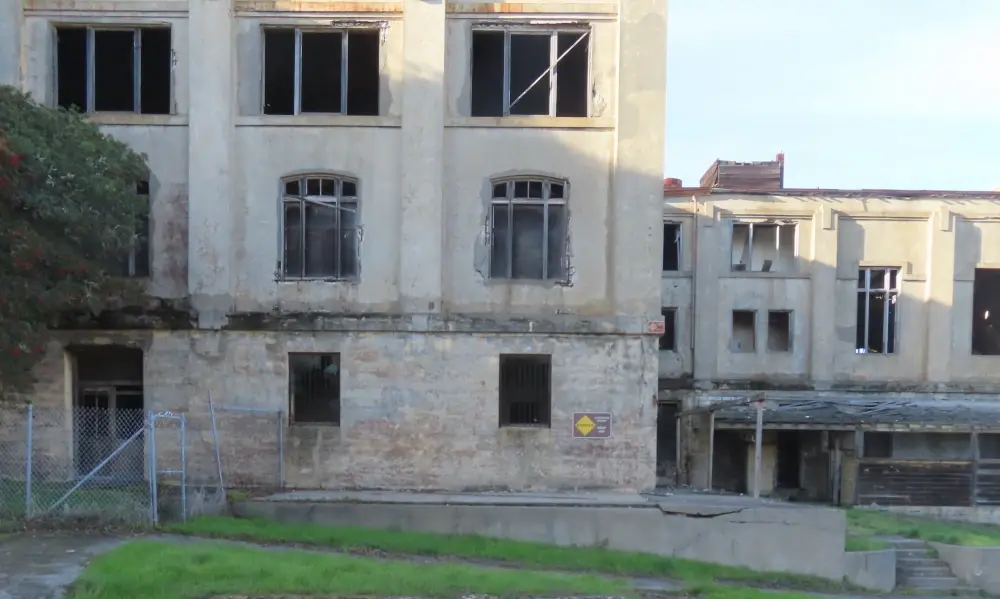 Mutiple empty buildings with windows without glass