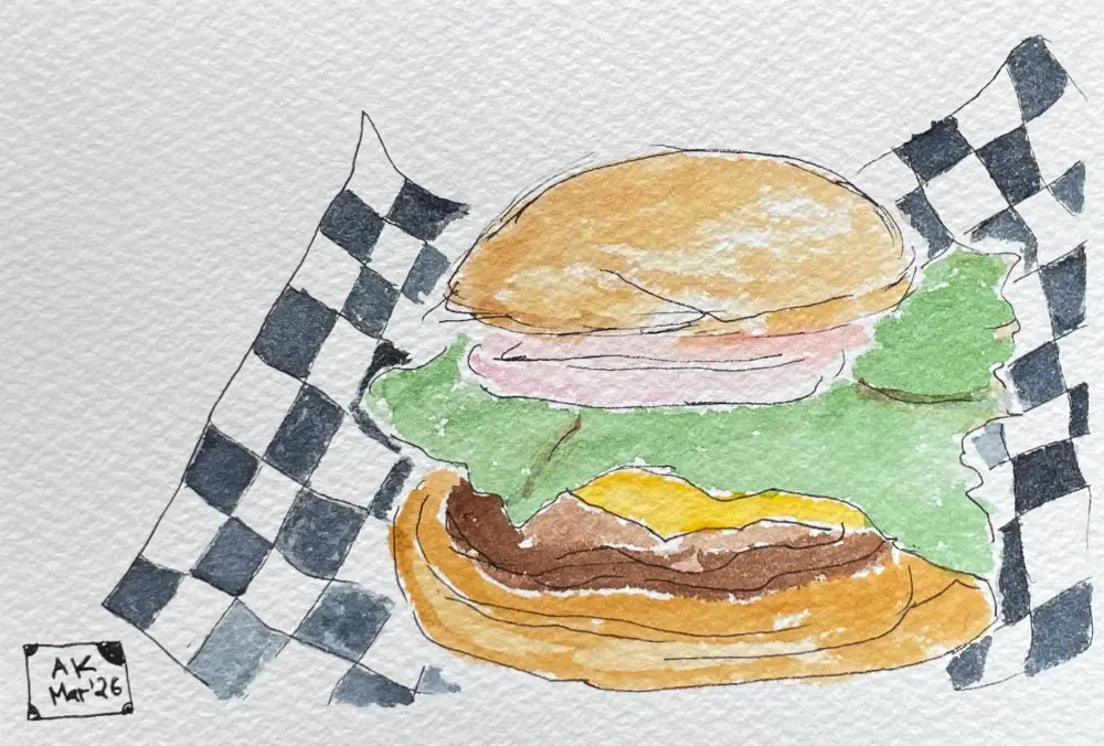 An illustration style painting of a hamburger with a very large piece of lettuce. The burger is on top of a checkered piece of paper that curls up somewhat. The contours are painted in ink and the burger is colord in with watercolor.