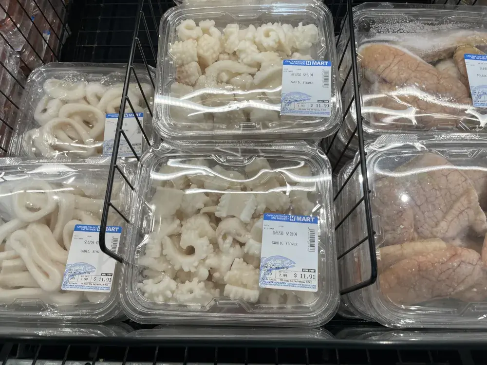A close up view of frozen packages of frozen squid