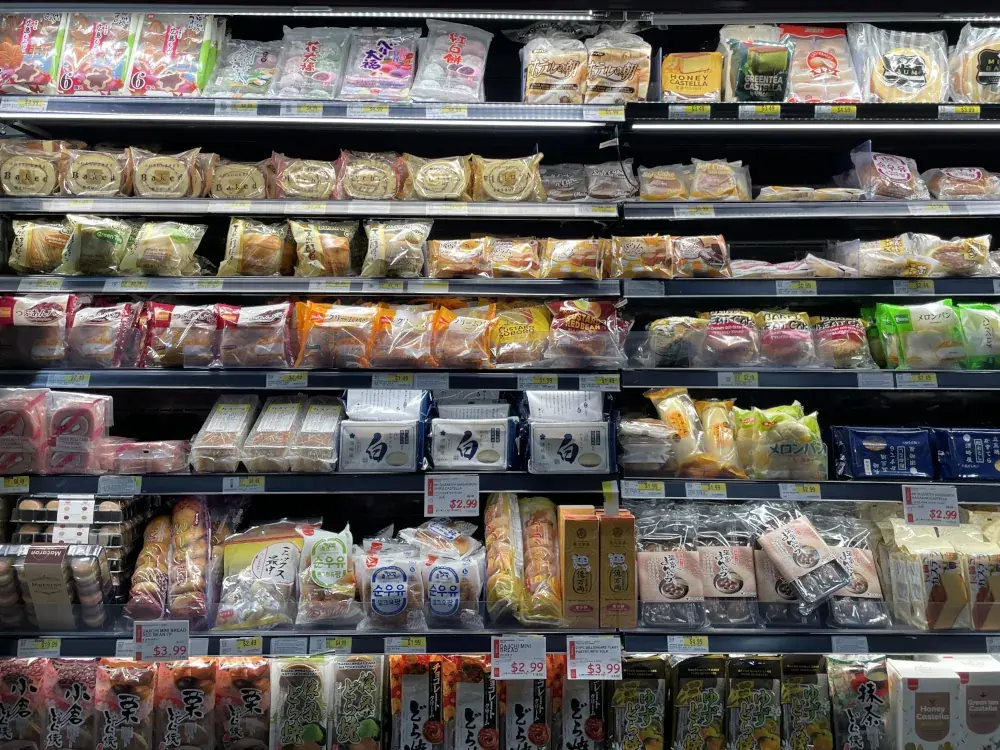 A cabinet full fo prepared sweet snacks