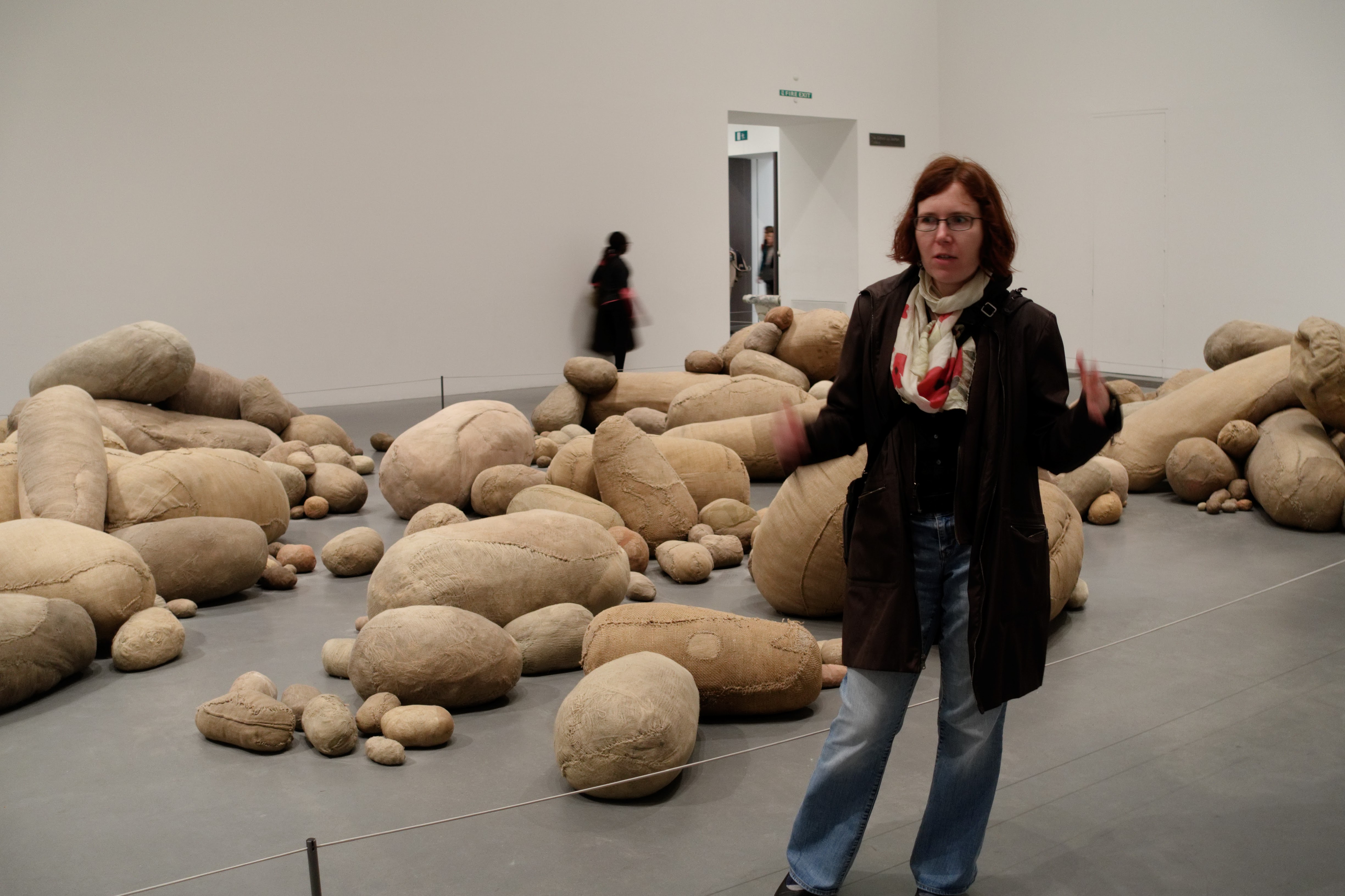 Author gesticulating in front of Embryology by Magdalena Abakanowicz at Tate Modern
